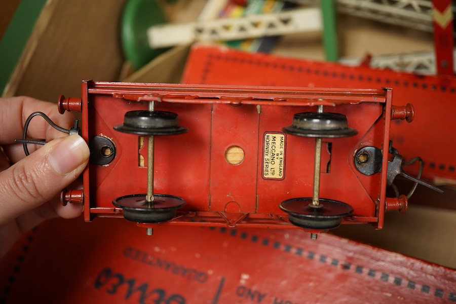 A collection of Hornby 0 gauge tinplate clockwork railway, including; a boxed No.1 Special GWR 0-4-0T locomotive, 5500, complete with original inner card packing pieces, etc., together with a boxed Dinky Toys No.1 Statio